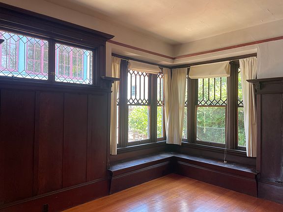 Dining room view 1 - windows look onto garden. More built in benches with storage.