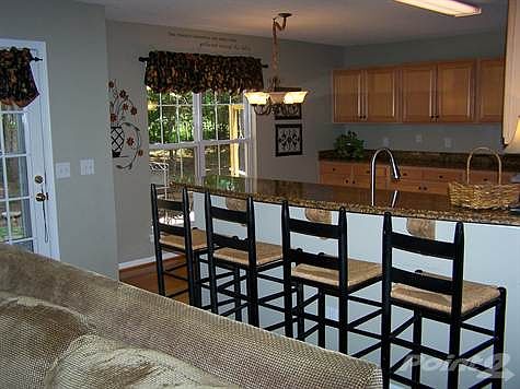 Updated kitchen with hardwoods and granite