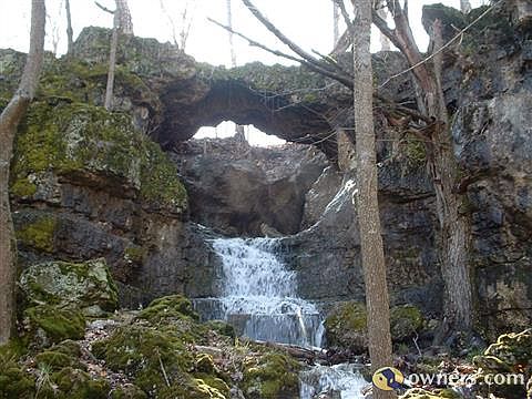 Natural Bridge Cave, spring flowing from cave after rainfall