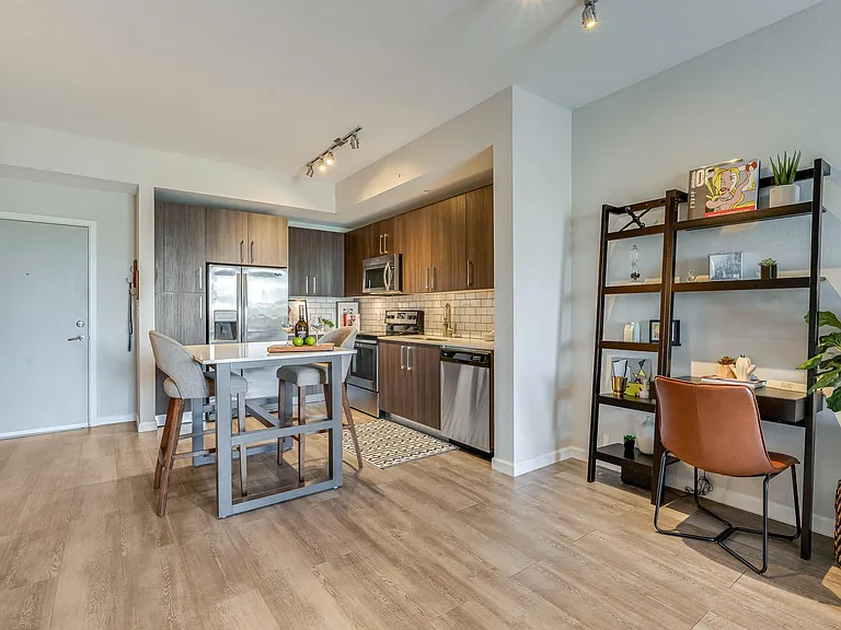 Kitchen and Dining Area with Built-In Shelves and Compact Work Desk