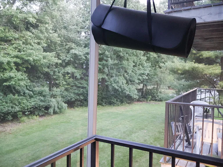 Private Balcony _ Accessible Directly from the Living Room and Overlooking the Backyard. Fully Enclosed with Protective Screening for Added Safety for Children while also helping keep mosquitoes and other insects out.
