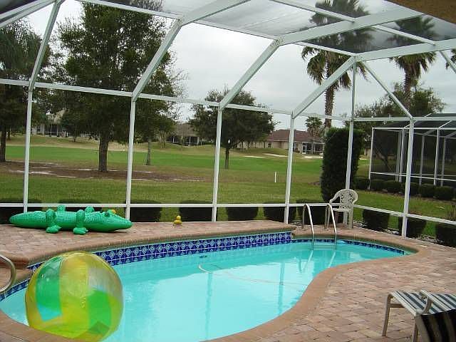 View of pool and golf course
