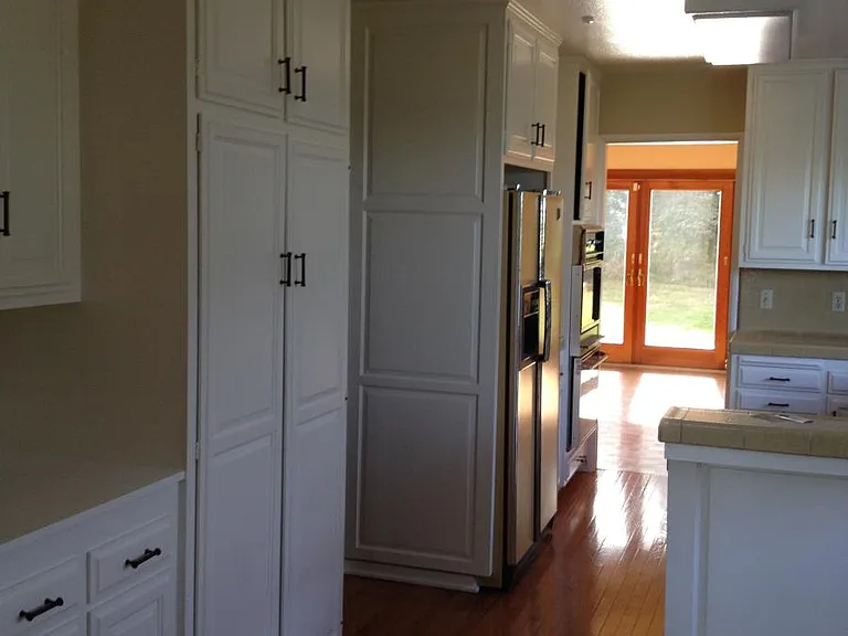 Kitchen open to living room 2 facing yard .