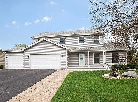 A wide, brick paver sidewalk leads to your front door and extends the 3-car driveway for wider vehic