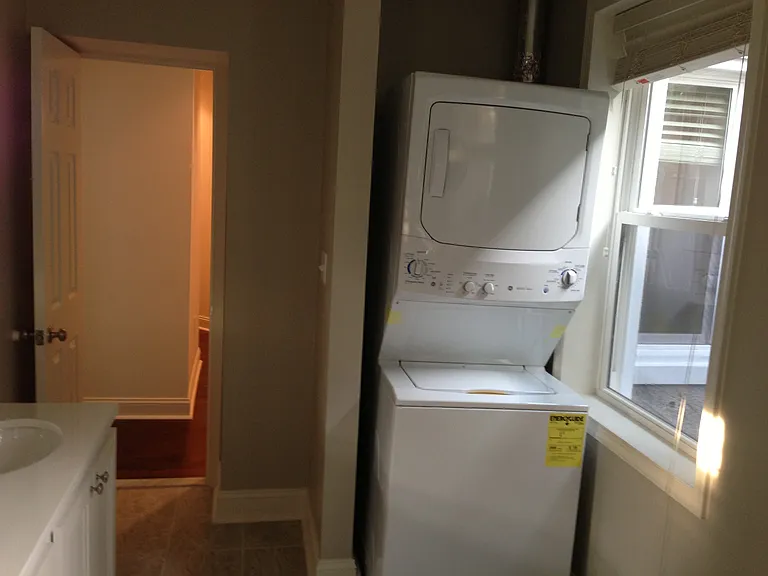 2nd floor bathroom, showing stackable washer/dryer