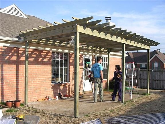 Extended patio with pergola and Hunter outdoor fan