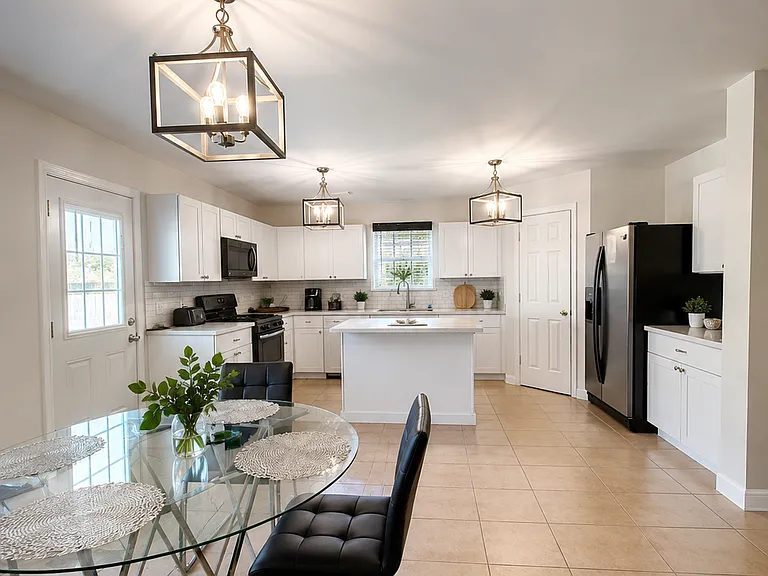 Kitchen and dinning room. Island in back where you have additional seating if you add bar stools.