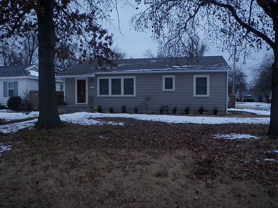 Front of house, faces West.