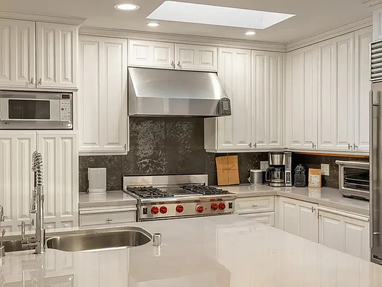 Step into culinary luxury in the well-appointed kitchen, where modern design meets functional elegance.