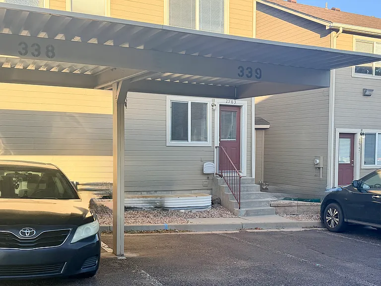 Reserved covered carport (#339) with nearby guest/open parking.