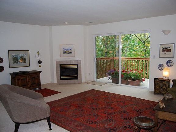 All the rooms are large and open. The living room has a cozy gas fireplace and a deck overlooking wo