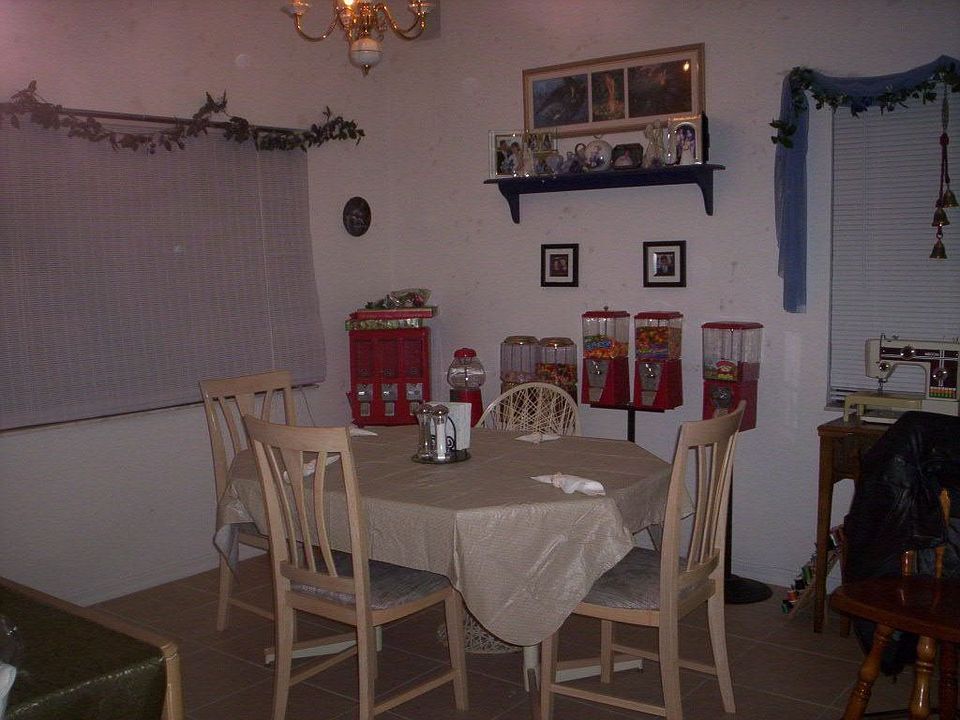 Dining Room Area. Large window looks out onto the backyard and canal.