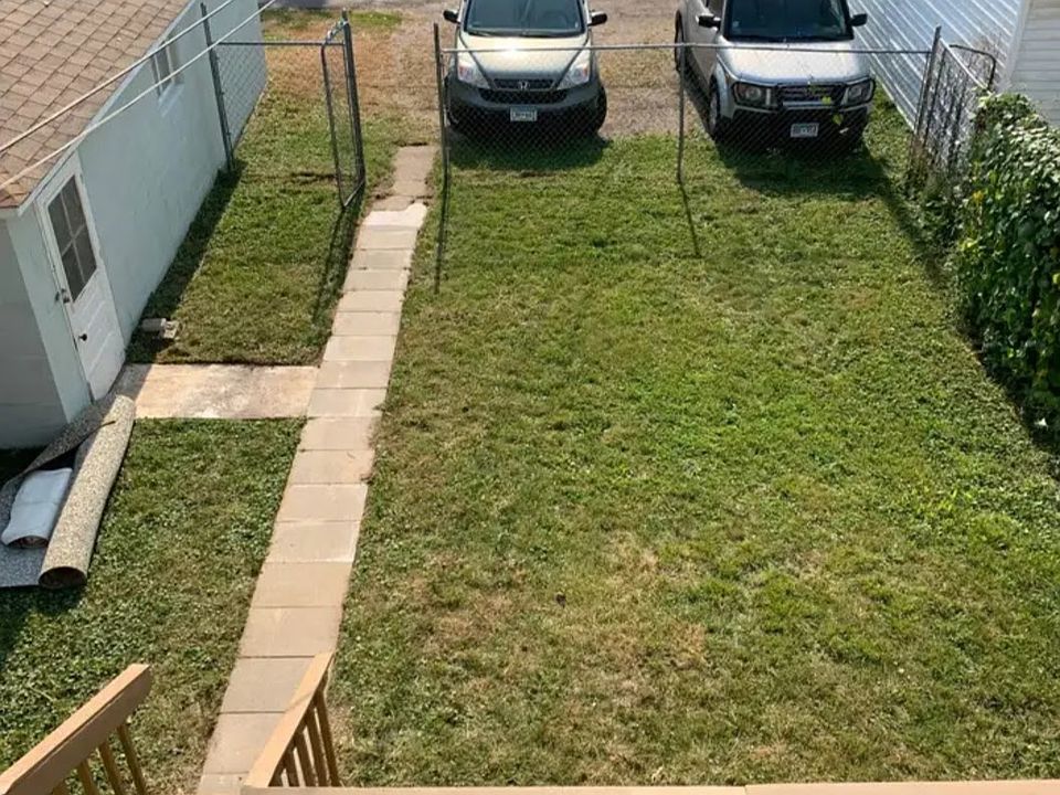 View from the upstairs balcony, looking down on the downstairs deck and the fenced yard, ALL yours.
