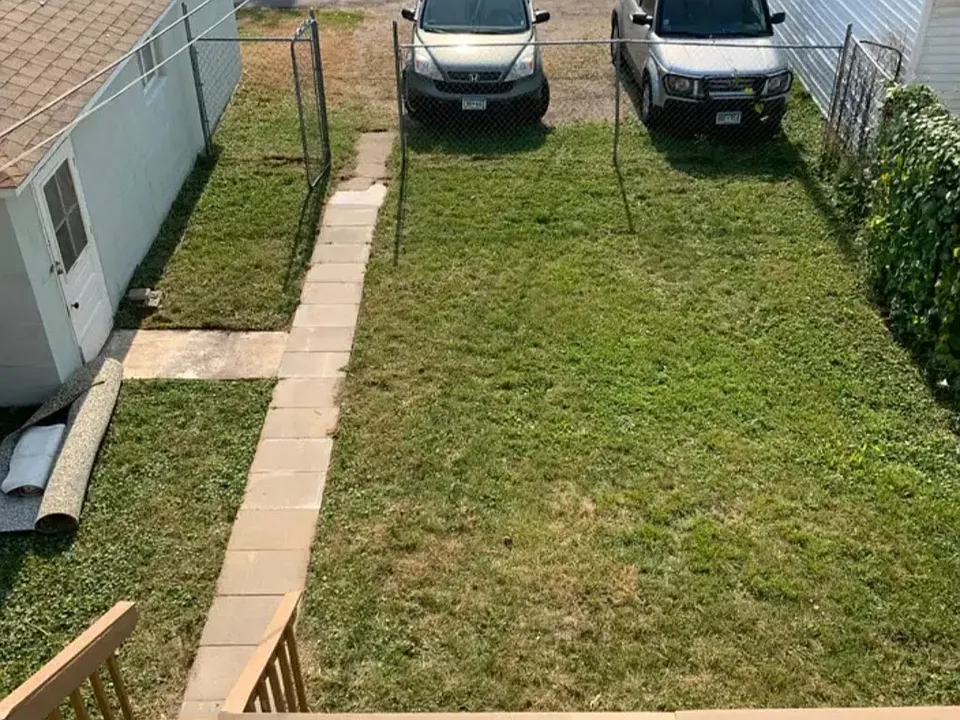 View from the upstairs balcony, looking down on the downstairs deck and the fenced yard, ALL yours.