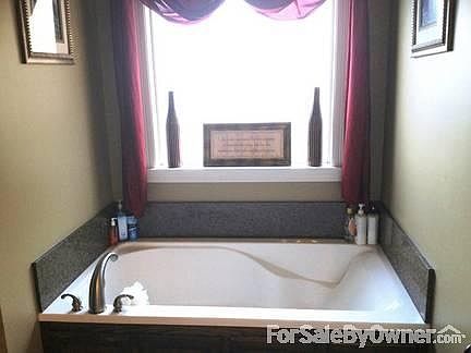 Half Bath located off of kitchen.