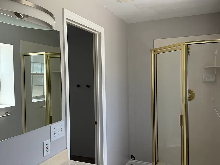 Downstairs full bathroom; shower, sink & toilet.