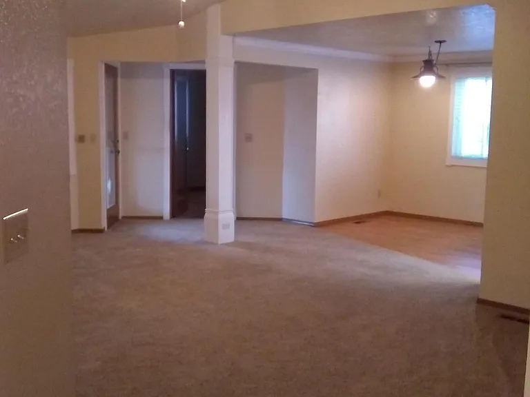 Family room/Great room area with Den and Kitchen table area in background