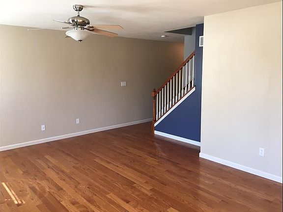Great room from dining area, ceiling fan