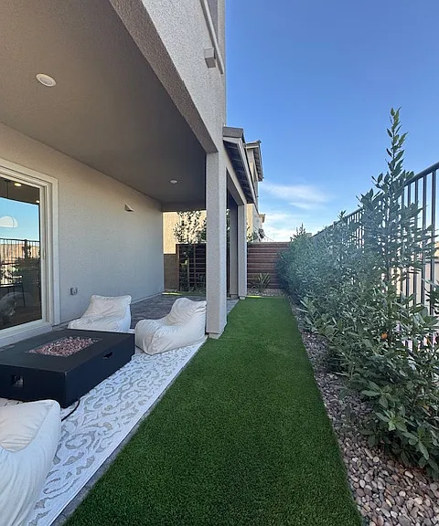 beautifully landscaped backyard for privacy and dog run on the side of home