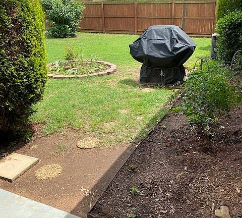 Backyard; gas grill connected to natural gas