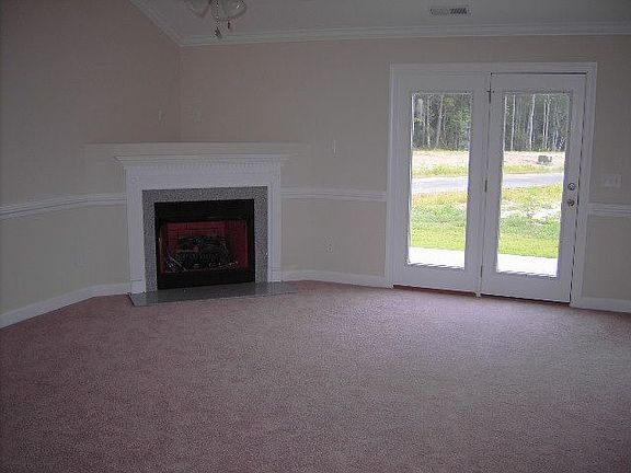Living Room With Granite Surround Fireplace
