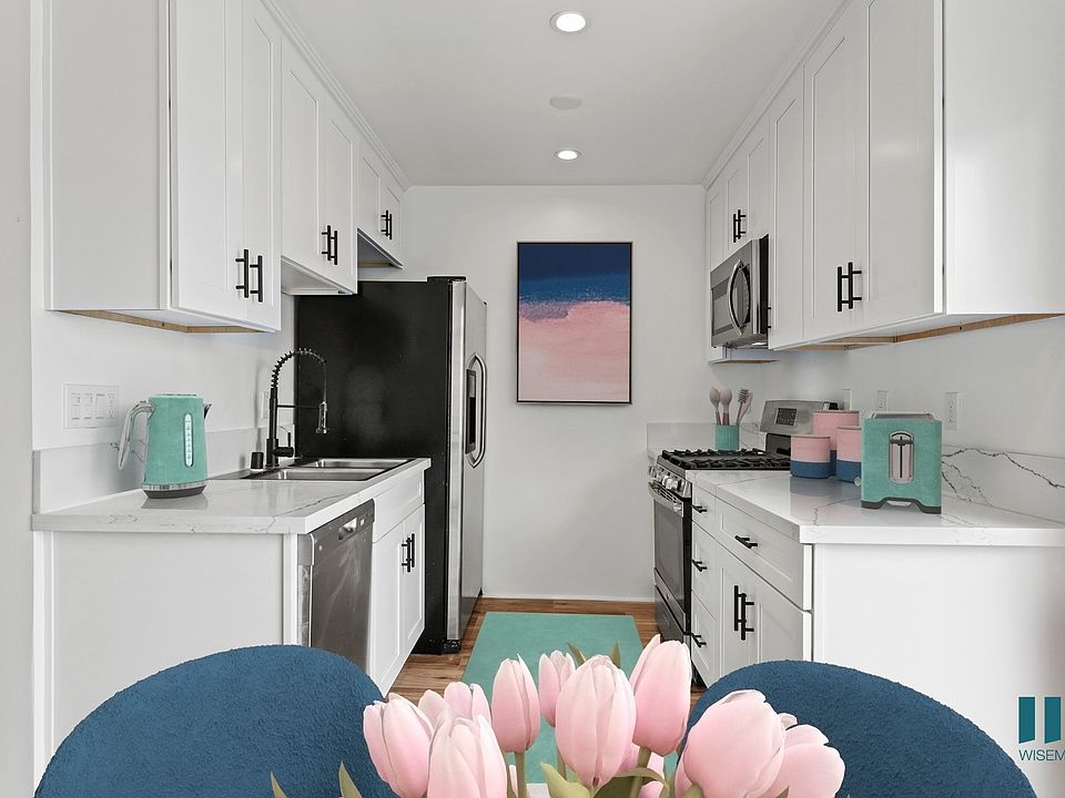 Kitchen with Stainless-Steel Refrigerator, Stove, Dishwasher, and Microwave Oven