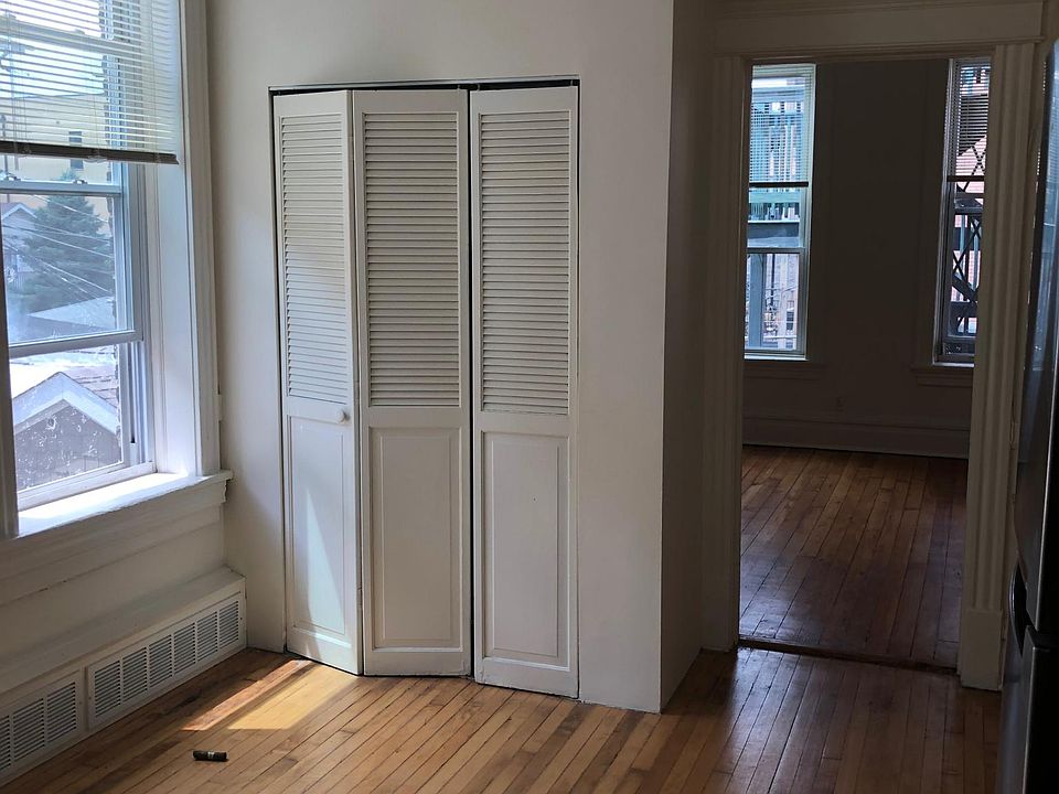 From kitchen looking into living room. Louvered doors are for water heater and furnace.