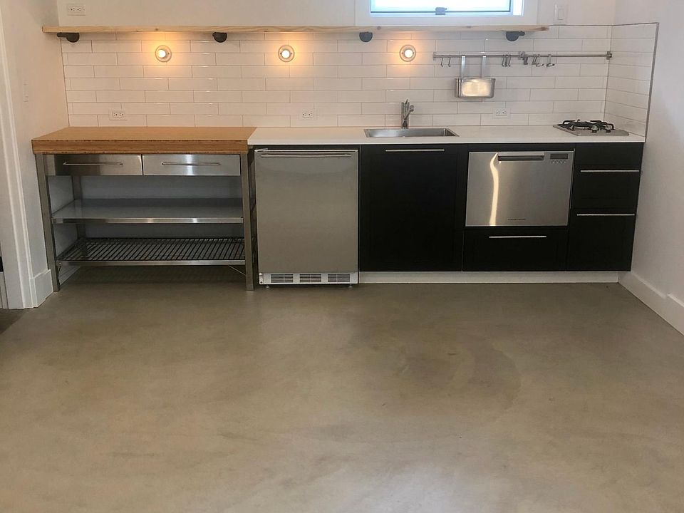 Kitchen with brand new fridge, dishwasher, and burner