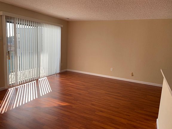 18 square foot living room floor with sliding glass doors to a private balcony