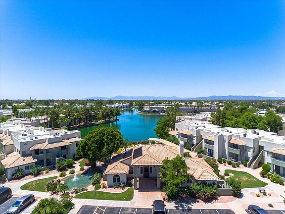 Overview of Clubhouse, lake, and building on left