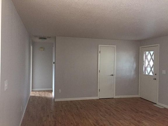 New laminate flooring, painted trim and windows