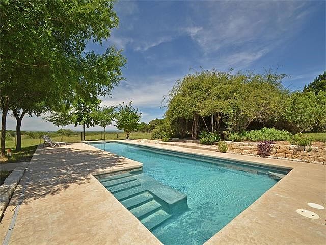 Enjoy incredible Hill Country sunsets from this 53 ft lap pool.