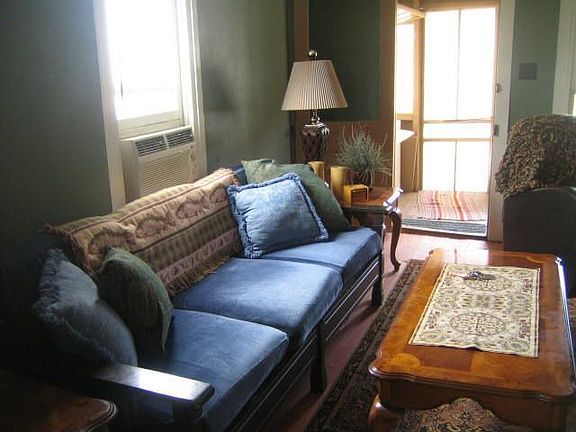 Cozy living room and screened front porch