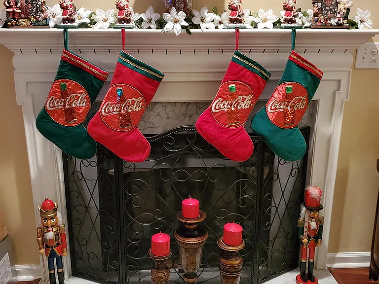 Family room fireplace mantle with Coca-Cola Christmas Decor