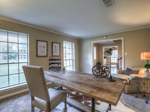 Just off to the right of the entry is an inviting formal living room/study. This room is flanked by two windows, which lets in n
