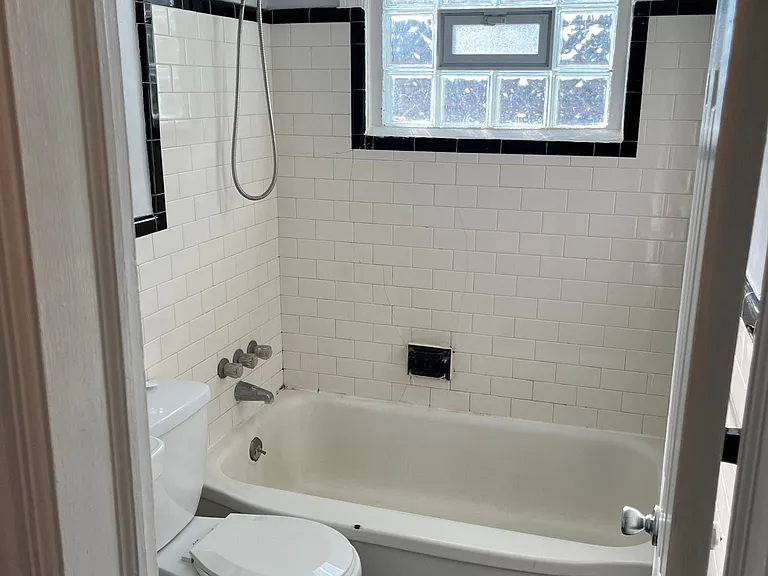 bathroom with glass block window