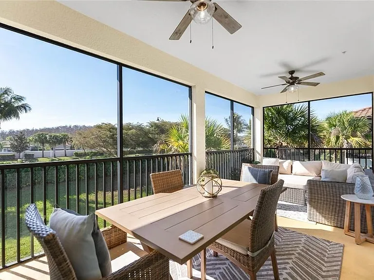 Large outdoor enclosed lanai with fans