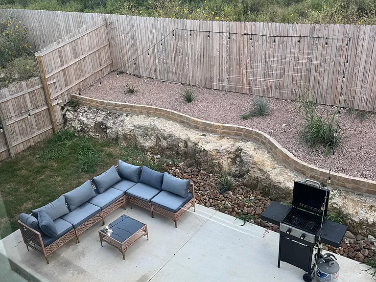 Fenced in backyard backs up to a greenbelt.