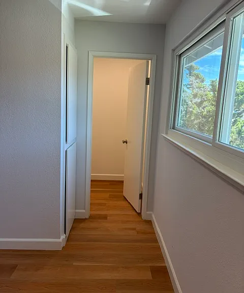 Upper level primary bedroom with walk-in closet.