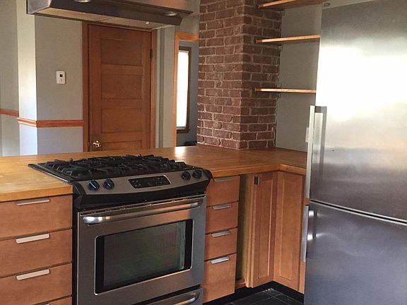 Gas stove and oven hood, open shelving
