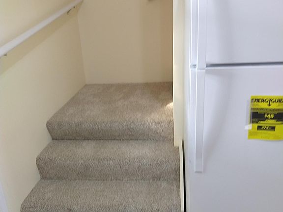 stairs off the kitchen to upstairs