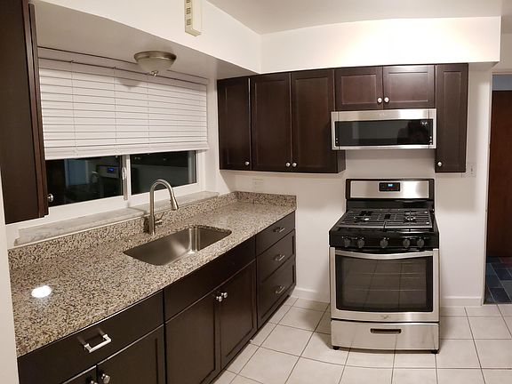 new cabinets, range and microwave