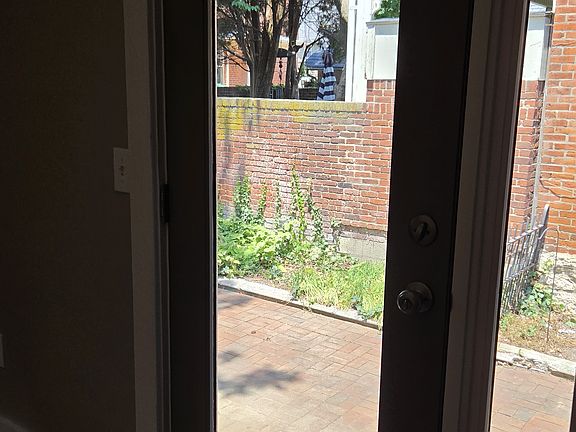From the bedroom, you have access to the fenced backyard