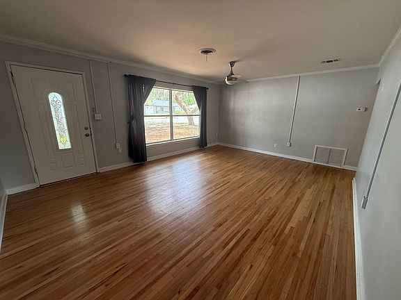 Spacious living room with lots of natural light.