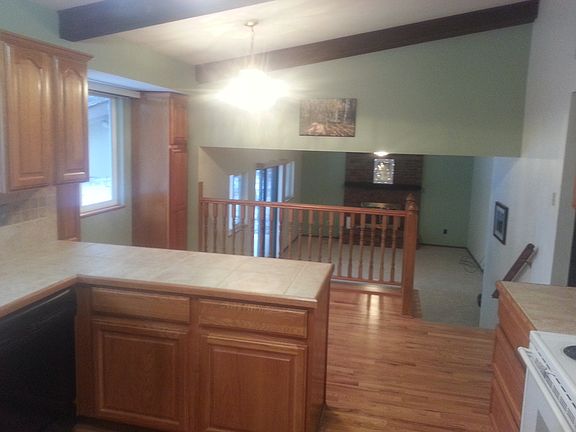 Kitchen overlooks family rm