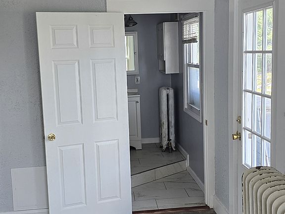 Front bedroom looking in bathroom