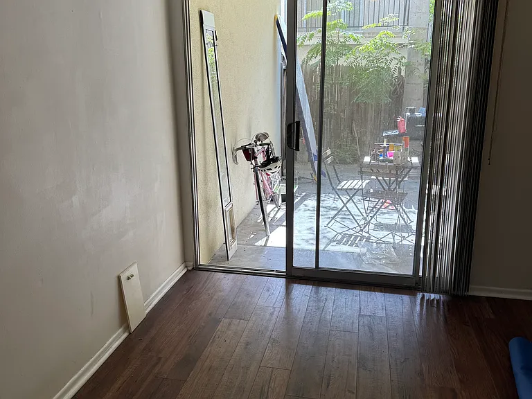 Bedroom 3 and private patio beyond.
