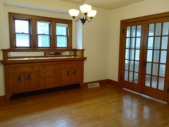 Built in buffet, French door to a sun room that is perfect for relaxing or could be a sunny home office
