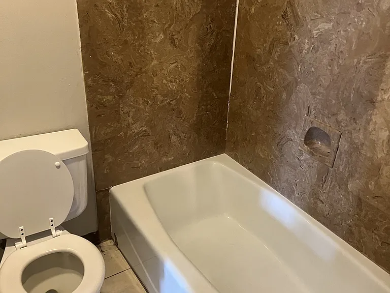 Bathroom with door to vanity area