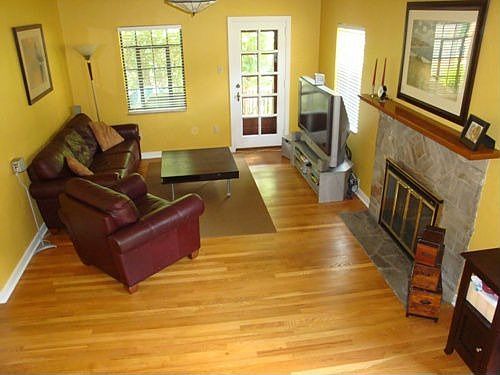 Living room with wood burning fireplace